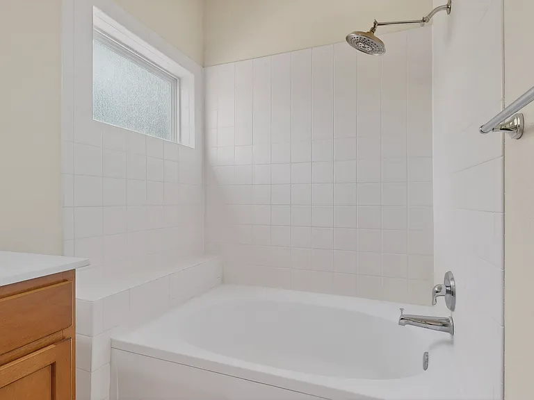 The primary bathroom also features a spa like large garden tub/shower combo to soak your cares away.