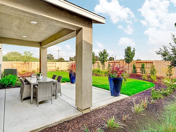 Patio with spacious backyard