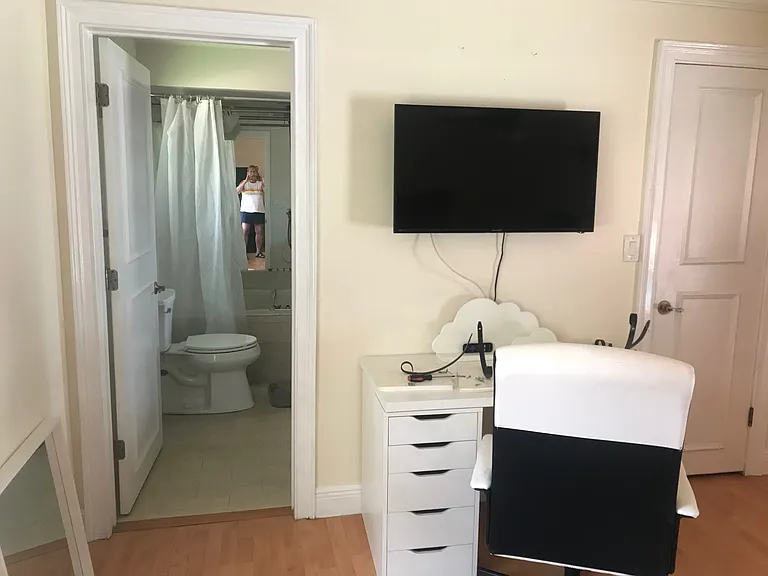 desk, office chair and smart TV