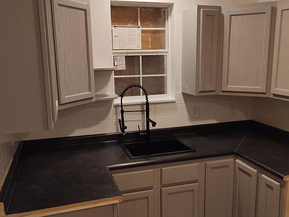 Updated kitchen with lots of cabinet space and laundry hookups