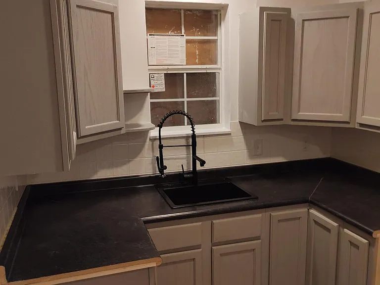 Updated kitchen with lots of cabinet space and laundry hookups