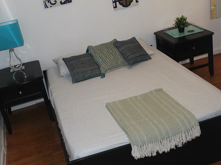 Bedroom 2 is large, with office nook and full bath. Once held 2 twins, this is picture with a queen