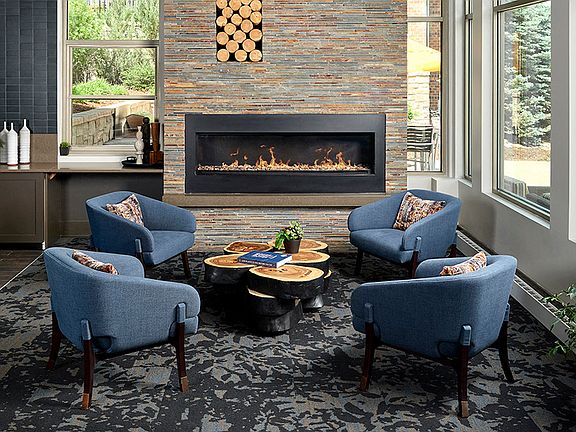 Newly remodeled resident lounge with cozy fireplace