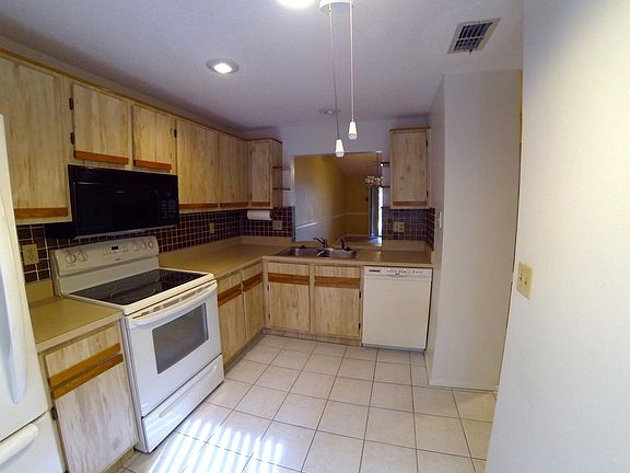 Kitchen with breakfast bar open to living room/dining room