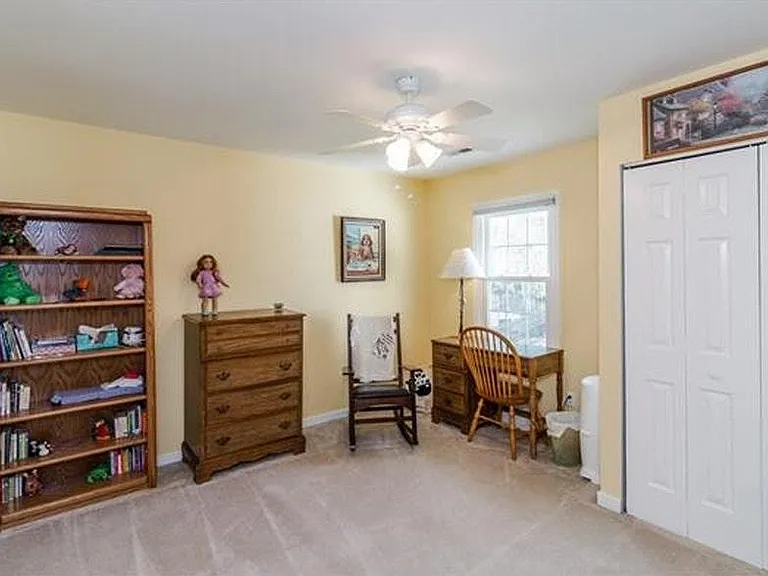 Bedroom with closet. Window faces back yard.