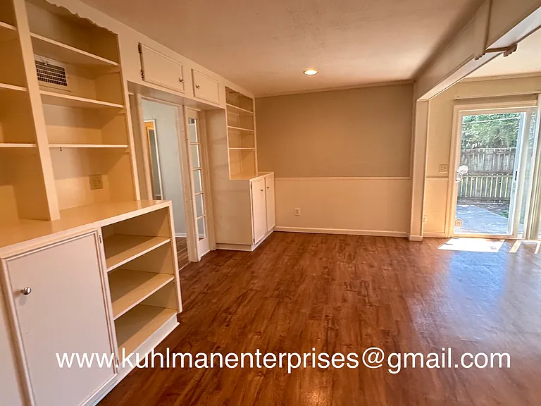 2nd living area is open to the kitchen and back porch.