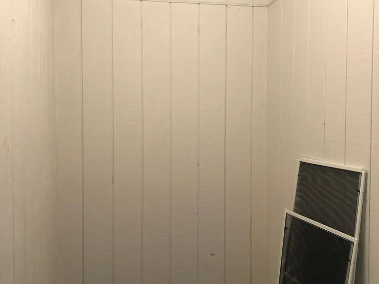Storage unit and screens for all of the windows in the apartment.