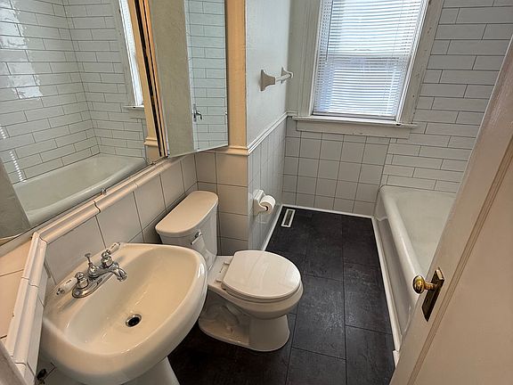 Bathroom with sink, shower, bathtub, toilet and medicine cabinet