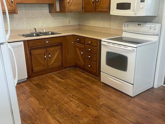 Charming Kitchen with lots of cabinetry.