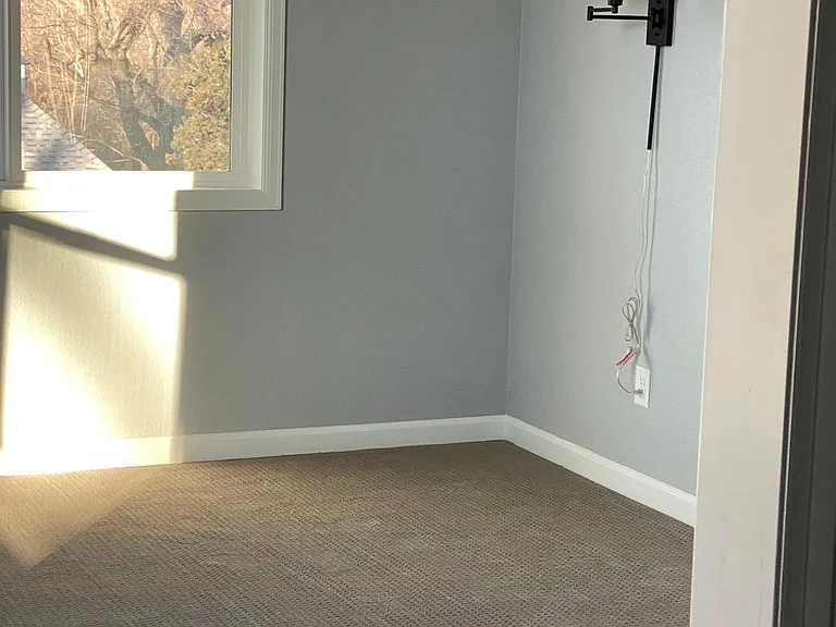 Wall sconces provided to allow for comfortable bed reading. This bedroom was designed for a king size bed, so there is plenty of room for bed and dressers.