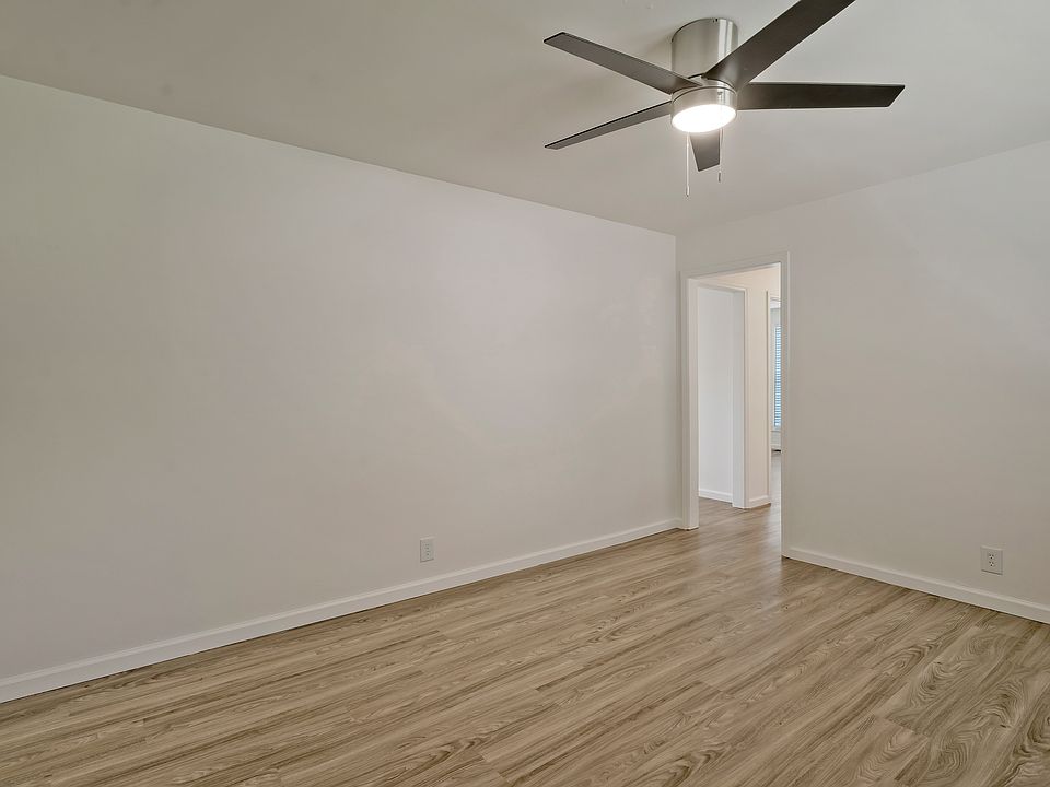 Living room- new flooring, ceiling fan and blinds
