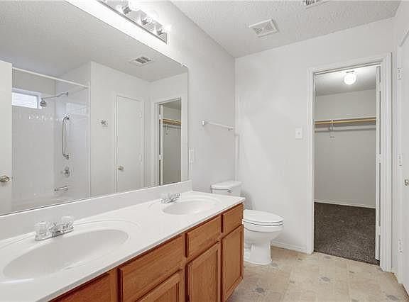 Master bathroom right off of the master suite with dual sink vanity, walk-in closet, huge vanity closet and a full shower, shown in the next picture.