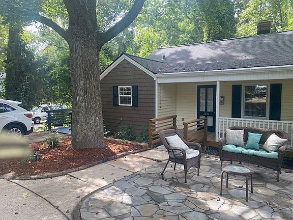Parking pad with side entrance to kitchen