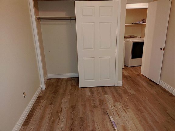 Freshly painted closets with new flooring.