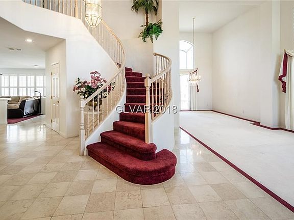 Spectacular entry .. Winding Staircase with Marble Flooring..Formal Living Room Formal Dining Room