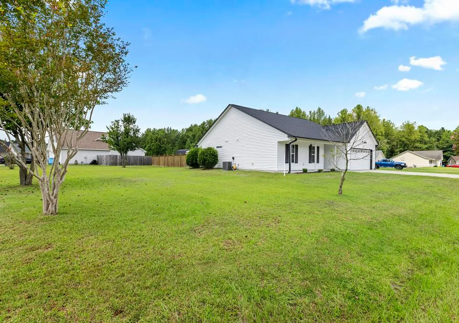 Corner-Lot Gem with Bonus Garage Space & Entertainer's Backyard! — Photo 3
