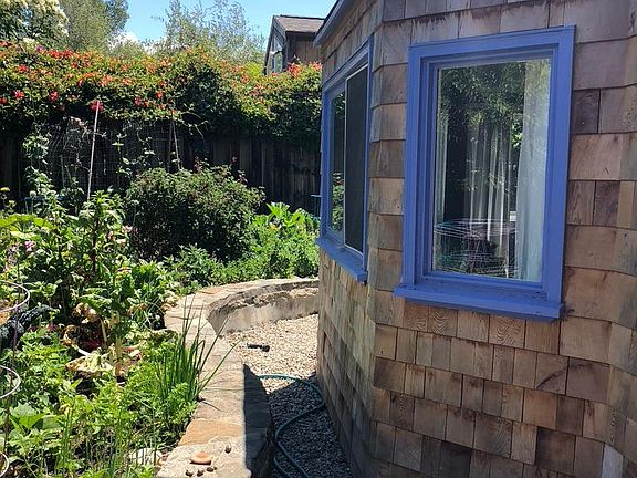 Windows look out over vegetable garden