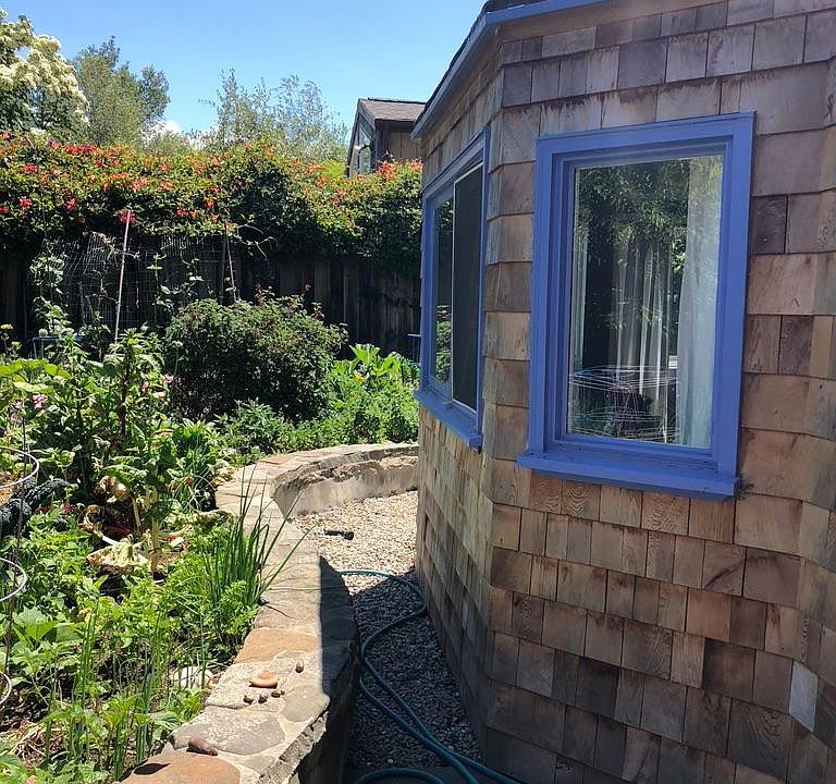 Windows look out over vegetable garden