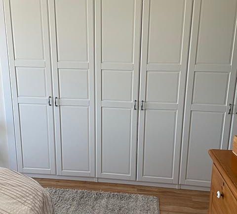 Bedroom with large closet and wood floor