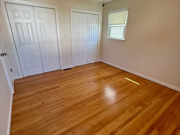 Queen size second bedroom with double closets