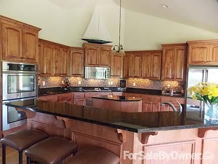 Gourmet kitchen
						:
						Black granite counters, mosaic back splash, custom cabinets