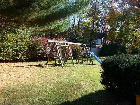 Backyard with wooden swingset