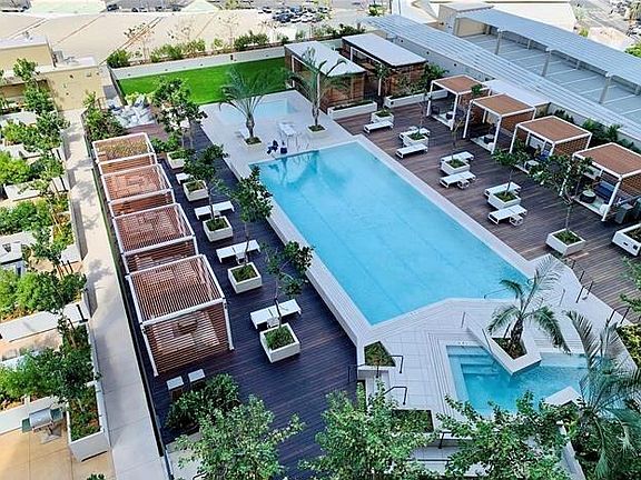 View of the Level 8 pool, Jacuzzi and cabana amenities deck from the lanai