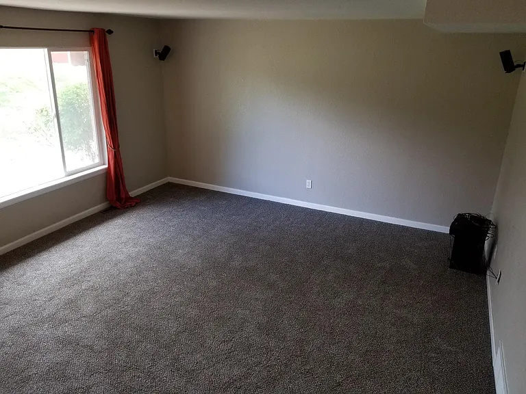 Living Room with Wired-In-Wall Surround Sound System and Sony Blu Ray Player