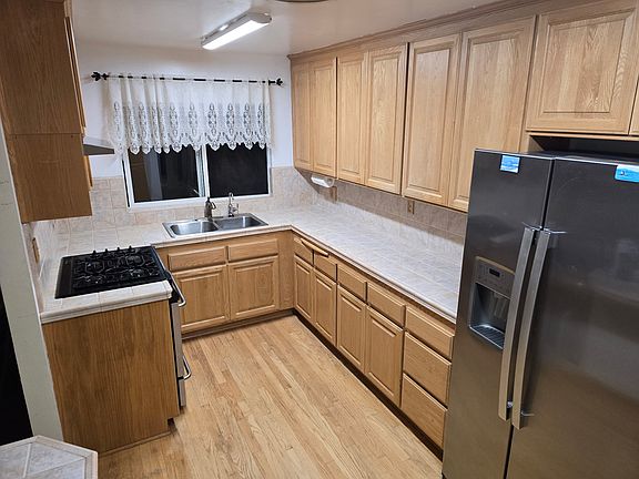 Galley Kitchen with 2 seat bar seating.