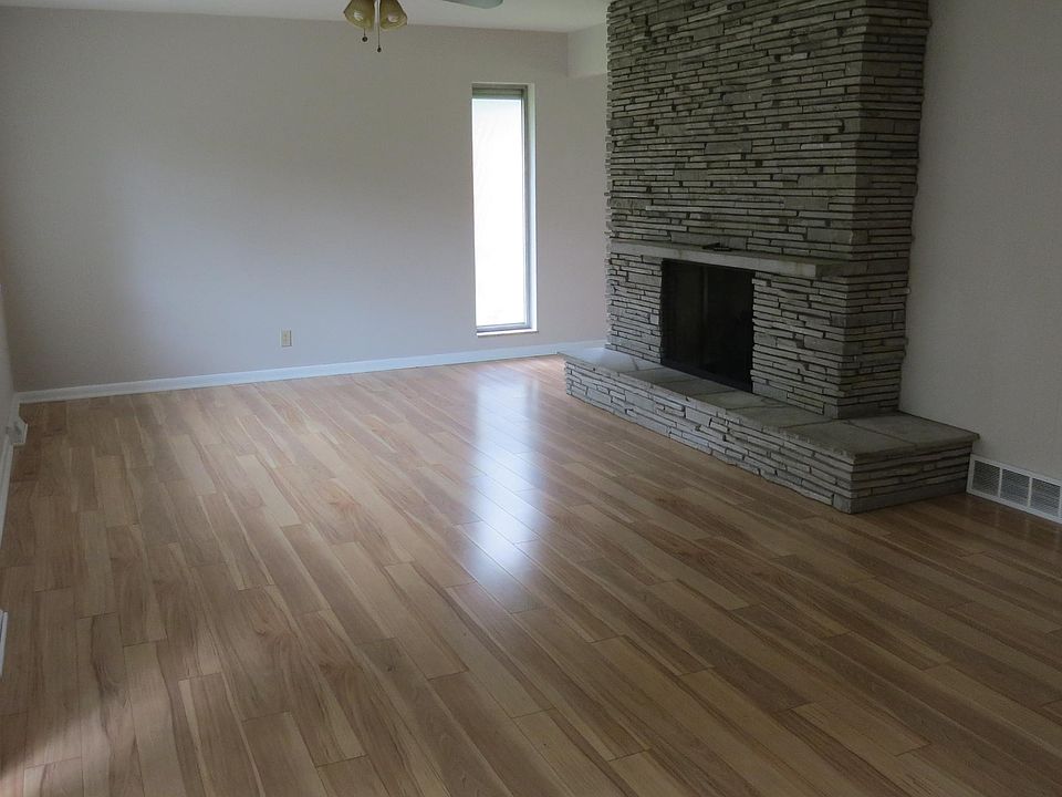 family room with see through fire place. Large windows and sliding glass doors