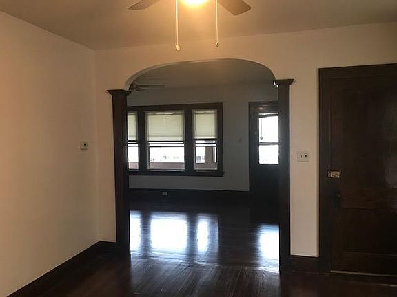 High ceilings and beautiful architectural details. All new ceiling fans throughout