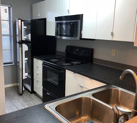 Updated refrigerator, stove, microwave & dishwasher included