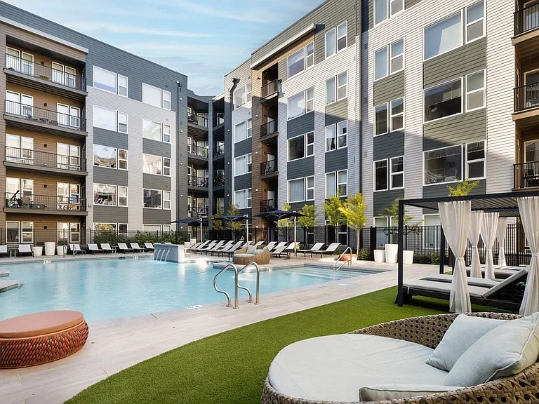 Courtyard with pool, cabanas and lounging areas