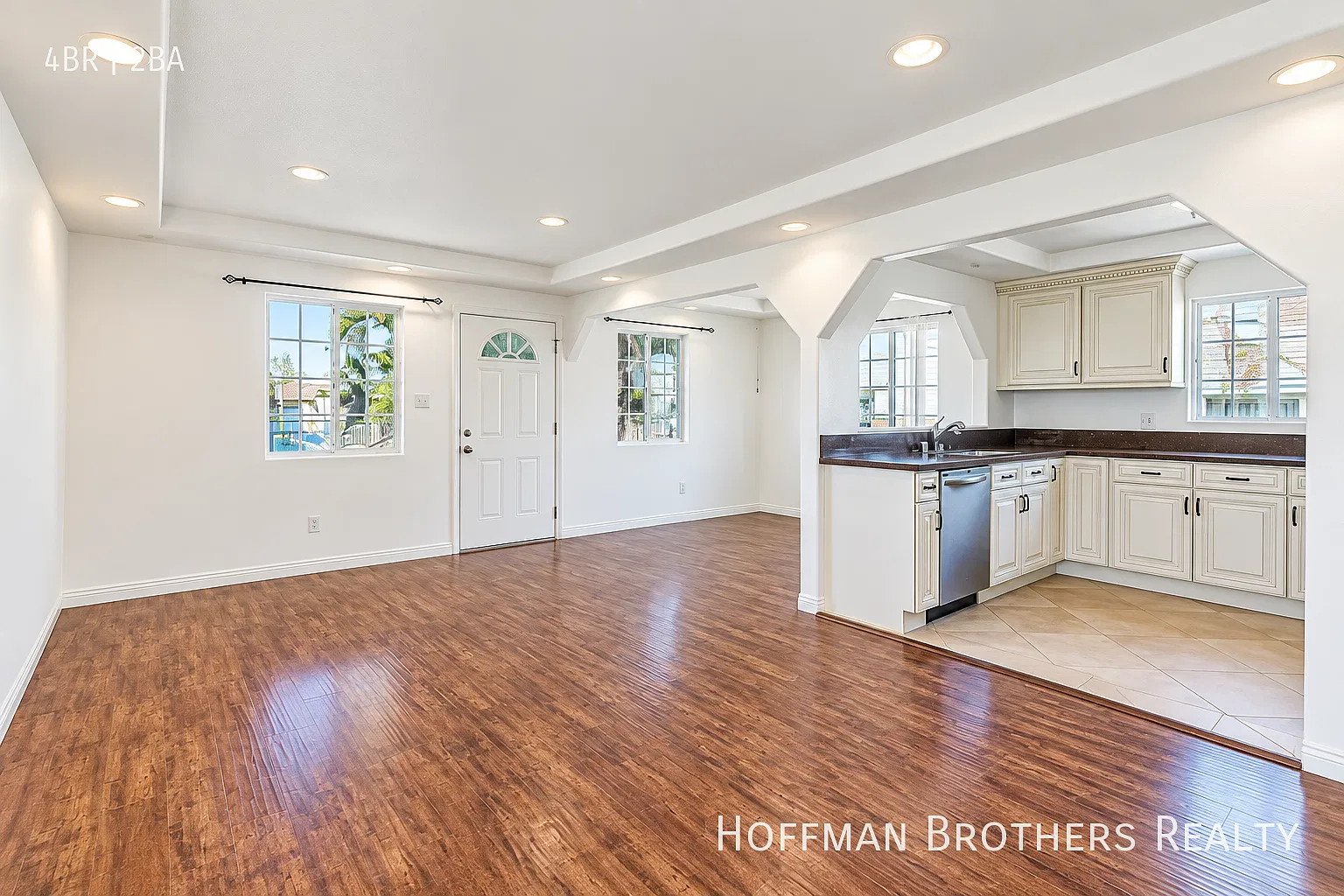 Renovated Townhouse with Open-Concept Living, Porch, In-Unit Laundry And Parking — Photo 1