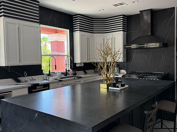 The new, expansive kitchen provides ample space for cooking.