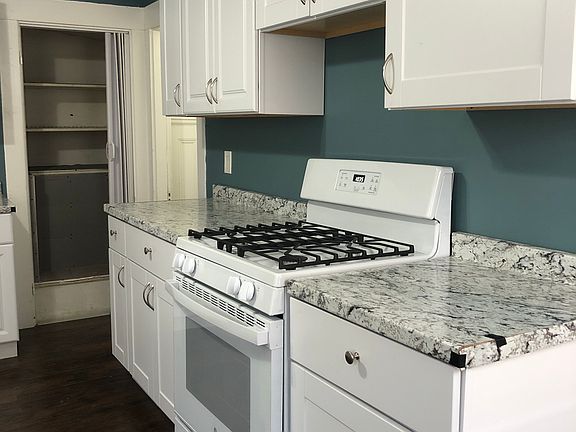 Kitchen with newer cabinets and gas stove