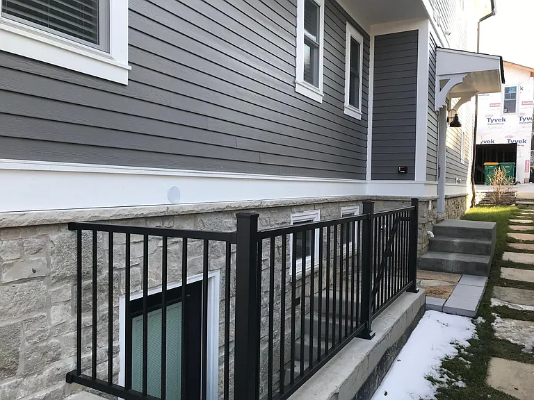 Entrance to garden apartment is on side of house