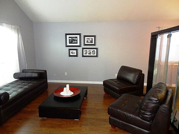 Combo area for formal living and dining with raised ceilings
