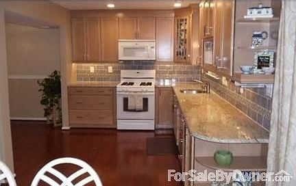 Kitchen view from eat-in
						:
						kitchen from eat in area 
right side is 6 ft opening to dining rm