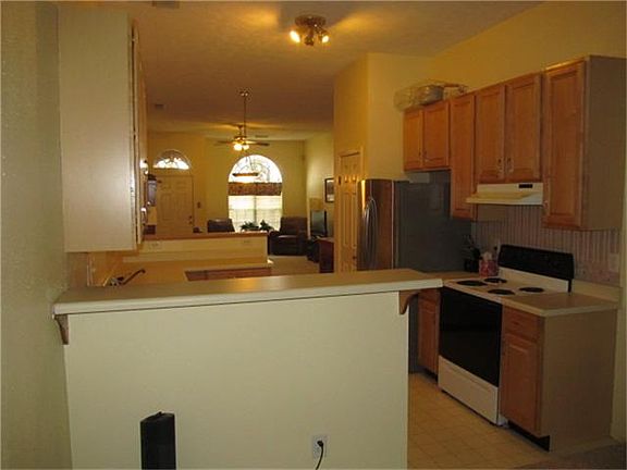 BREAKFAST BARS ON BOTH SIDES OF KITCHEN