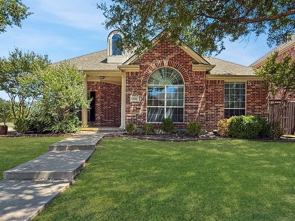 Front of home with covered porch.