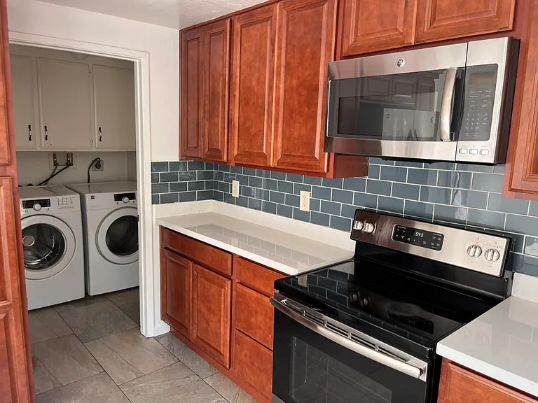 Utility room with washer and dryer
