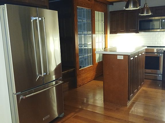View of the kitchen as you enter the beauiful space