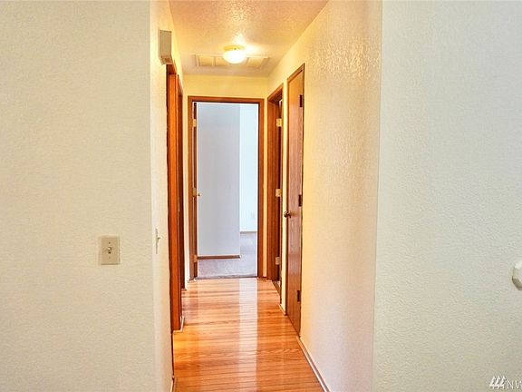 Hallway to the right with all bedrooms and bathrooms as soon as you enter home.