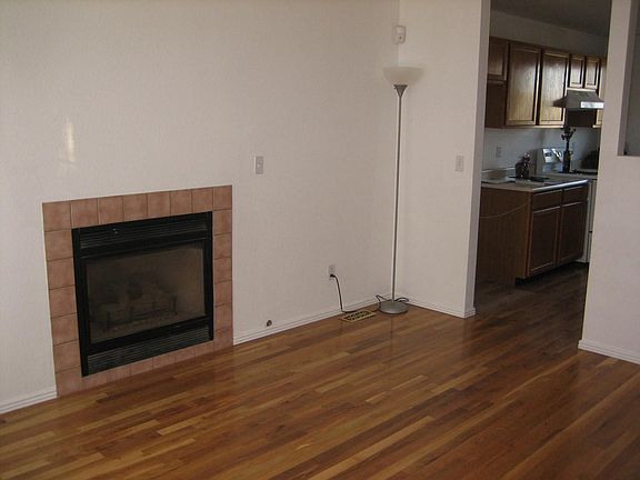 Livingroom w/ firplace and hardwood floors