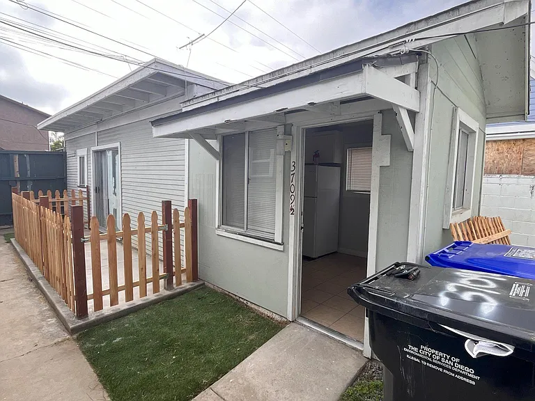 front of the unit with a fenced-in patio