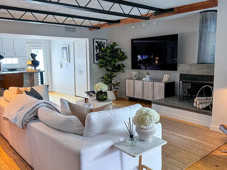 Living room with real hardwood floors and working wood fireplace