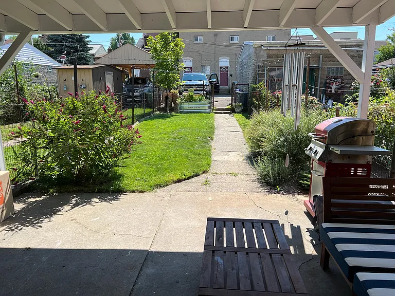 landscaped yard and covered porch for entertaining