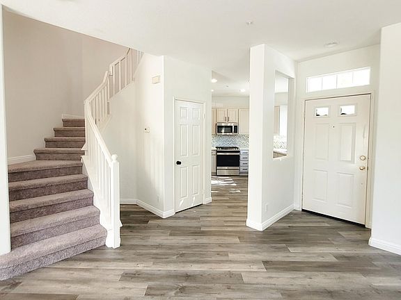 Brand new vinyl flooring, new carpeted stairs, newly painted with grey dual layer roller shades