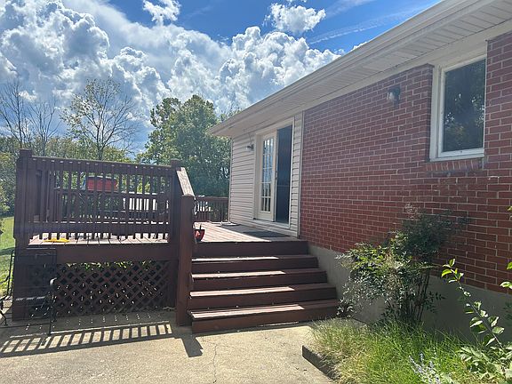 Concrete patio leading to deck